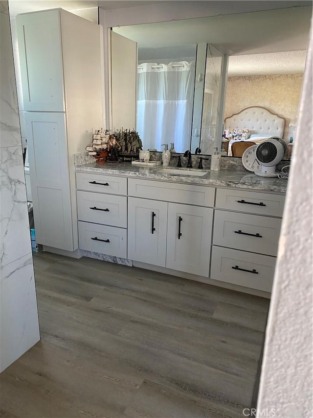2113 N Lewis St, Santa Ana, CA 92706 - bathroom with wood finished floors and vanity