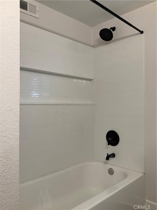 2113 N Lewis St, Santa Ana, CA 92706 - bathroom featuring a textured wall and shower / bath combination