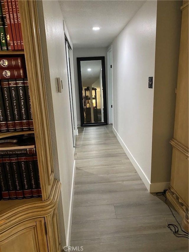 2113 N Lewis St, Santa Ana, CA 92706 - corridor featuring light wood-style floors, baseboards, and recessed lighting