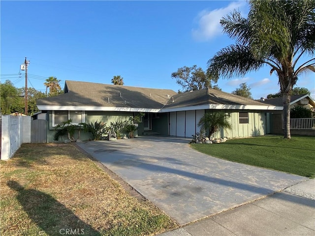 2113 N Lewis St, Santa Ana, CA 92706 - ranch-style house featuring board and batten siding and concrete driveway