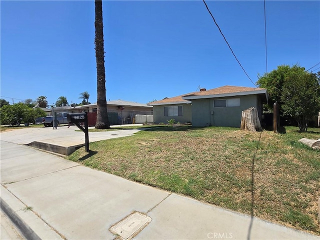 6025 Florence St, Riverside, CA 92504 - ranch-style home with a front yard and stucco siding