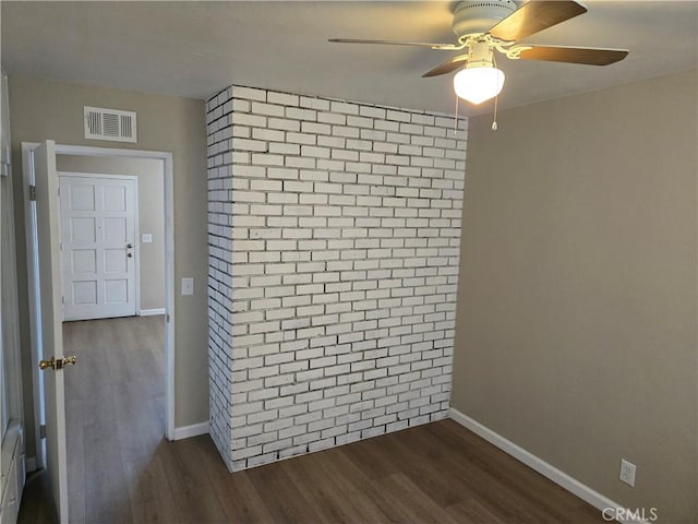 6025 Florence St, Riverside, CA 92504 - spare room featuring dark wood-style floors, a ceiling fan, and baseboards