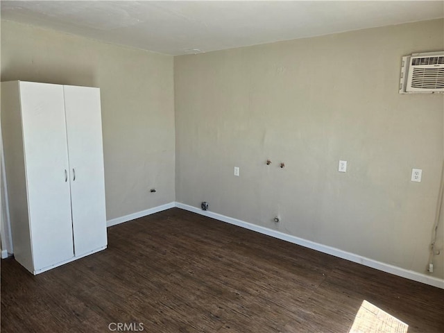 6025 Florence St, Riverside, CA 92504 - spare room with dark wood finished floors, baseboards, and a wall mounted AC