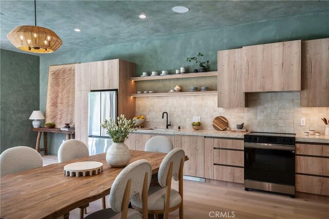 4314 Teesdale Ave, Studio City, CA 91604 - kitchen featuring range with electric stovetop, freestanding refrigerator, light brown cabinets, light wood-type flooring, and a sink