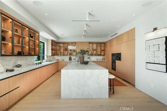 4314 Teesdale Ave, Studio City, CA 91604 - kitchen with modern cabinets, backsplash, and glass insert cabinets