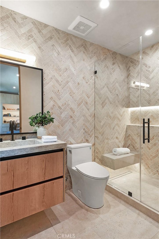 4314 Teesdale Ave, Studio City, CA 91604 - bathroom featuring vanity, toilet, a stall shower, recessed lighting, and tile walls