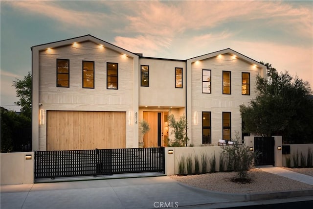 4314 Teesdale Ave, Studio City, CA 91604 - view of front of home featuring a gate, a fenced front yard, driveway, and a garage