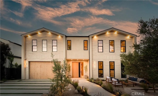 4314 Teesdale Ave, Studio City, CA 91604 - view of front of house featuring driveway, outdoor lounge area, and an attached garage