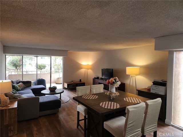 5658 Ravenspur Dr Unit 202, Rancho Palos Verdes, CA 90275 - dining space with a textured ceiling and dark wood finished floors