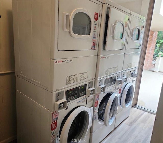 5658 Ravenspur Dr Unit 202, Rancho Palos Verdes, CA 90275 - shared laundry room with stacked washer / drying machine, wood finished floors, and washer and dryer