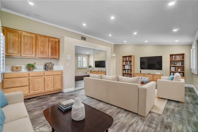 9455 Brandon Ct, Northridge, CA 91325 - living area featuring crown molding, wood finished floors, recessed lighting, and built in features