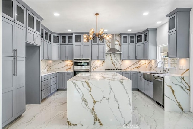 9455 Brandon Ct, Northridge, CA 91325 - kitchen featuring wall chimney exhaust hood, stainless steel appliances, gray cabinets, a center island, and recessed lighting
