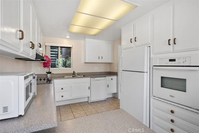 2117 Via Puerta Unit A, Laguna Woods, CA 92637 - kitchen featuring white appliances, a sink, and white cabinetry
