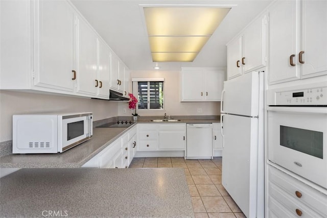 2117 Via Puerta Unit A, Laguna Woods, CA 92637 - kitchen with white appliances, a sink, light tile patterned flooring, and white cabinets
