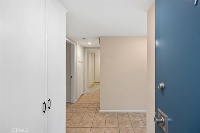 2117 Via Puerta Unit A, Laguna Woods, CA 92637 - hall featuring light tile patterned floors and baseboards