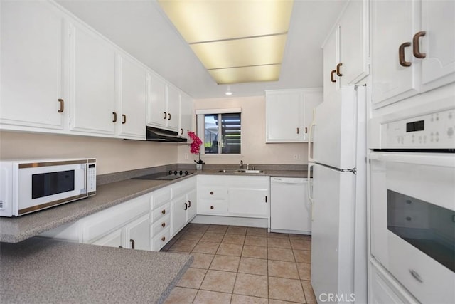2117 Via Puerta Unit A, Laguna Woods, CA 92637 - kitchen with white appliances, a sink, white cabinetry, light tile patterned floors, and under cabinet range hood