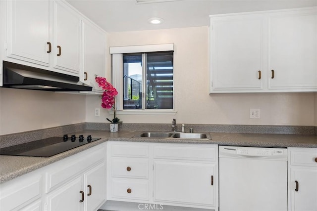 2117 Via Puerta Unit A, Laguna Woods, CA 92637 - kitchen with white dishwasher, a sink, under cabinet range hood, black electric stovetop, and white cabinetry