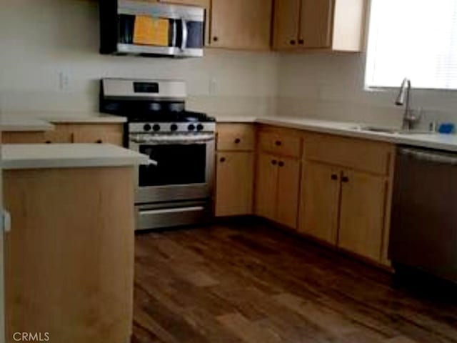 700 W La Veta Ave Unit K5, Orange, CA 92868 - kitchen with stainless steel appliances, a sink, dark wood-style flooring, and light countertops