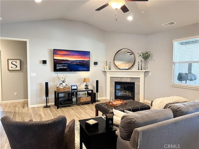 3471 Peerless Ln, Chico, CA 95973 - living room with a ceiling fan, light wood finished floors, lofted ceiling, a fireplace, and baseboards