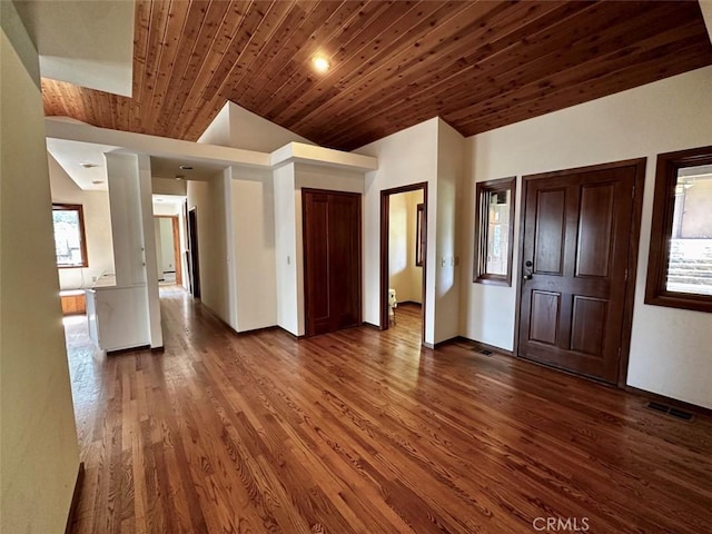 50771 Woodside Ln, Oakhurst, CA 93644 - foyer entrance with dark wood finished floors, wooden ceiling, and lofted ceiling