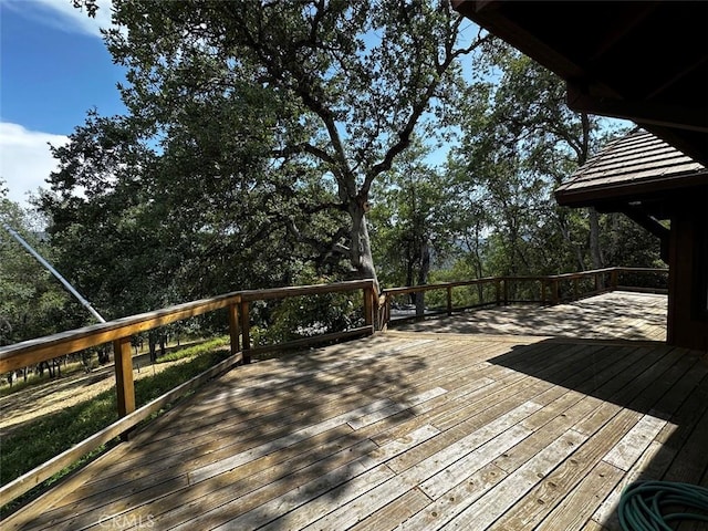 50771 Woodside Ln, Oakhurst, CA 93644 - wooden terrace featuring view of wooded area