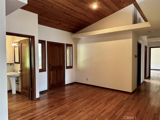 50771 Woodside Ln, Oakhurst, CA 93644 - foyer entrance featuring vaulted ceiling, dark wood-style flooring, and baseboards