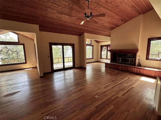 50771 Woodside Ln, Oakhurst, CA 93644 - unfurnished living room featuring lofted ceiling, dark wood-style floors, ceiling fan, wooden ceiling, and a glass covered fireplace