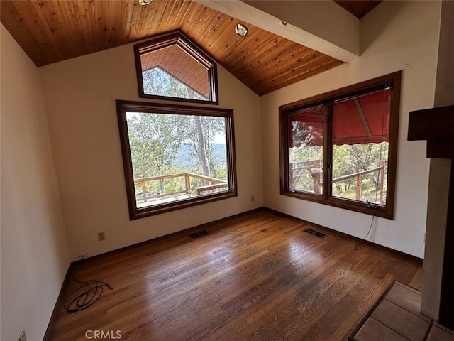 50771 Woodside Ln, Oakhurst, CA 93644 - spare room with healthy amount of natural light, lofted ceiling, wood finished floors, and wooden ceiling