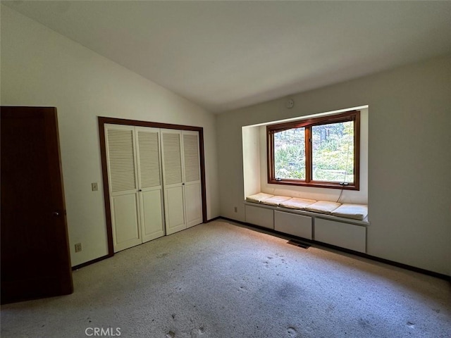 50771 Woodside Ln, Oakhurst, CA 93644 - unfurnished bedroom featuring vaulted ceiling, light carpet, baseboards, and a closet