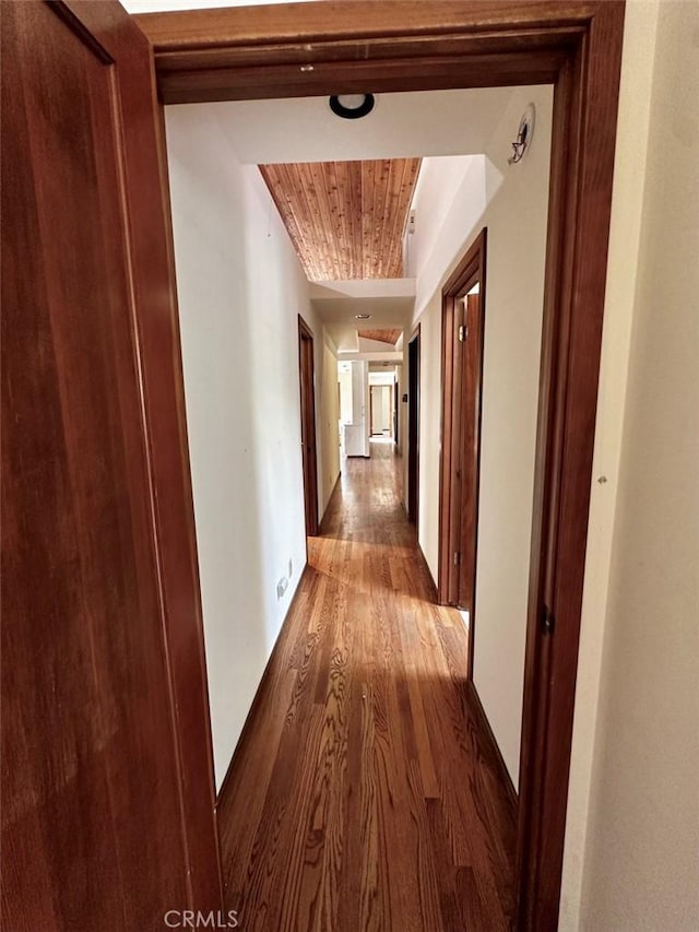 50771 Woodside Ln, Oakhurst, CA 93644 - hall with wood finished floors, wooden ceiling, and baseboards