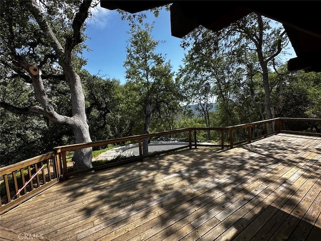 50771 Woodside Ln, Oakhurst, CA 93644 - wooden terrace with view of wooded area