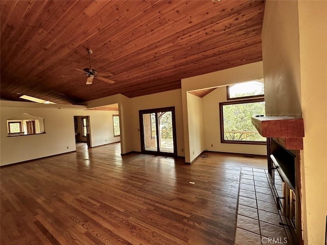 50771 Woodside Ln, Oakhurst, CA 93644 - unfurnished living room featuring lofted ceiling, healthy amount of natural light, wooden ceiling, wood finished floors, and a fireplace