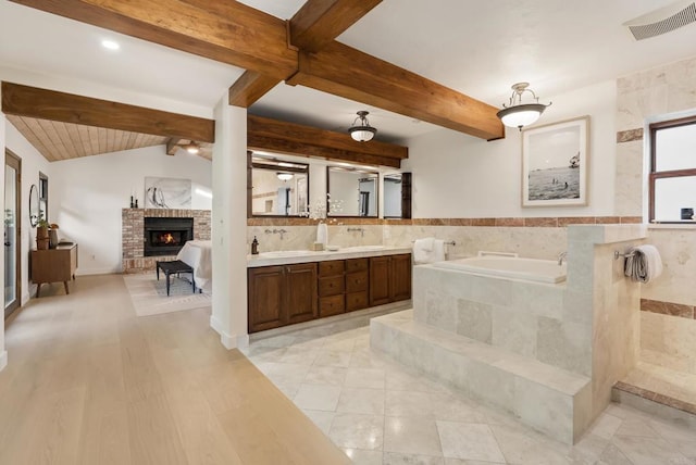 233233A Cole Ranch Rd, Encinitas, CA 92024 - full bathroom featuring beam ceiling, a brick fireplace, a bath, and double vanity