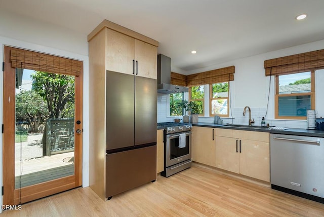 1828 Woodrow Ave, Los Angeles, CA 90041 - kitchen featuring stainless steel appliances, a sink, wall chimney range hood, dark countertops, and tasteful backsplash
