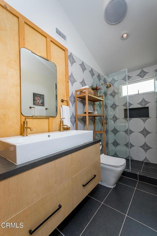 1828 Woodrow Ave, Los Angeles, CA 90041 - bathroom with tile patterned floors, a walk in shower, lofted ceiling, vanity, and toilet