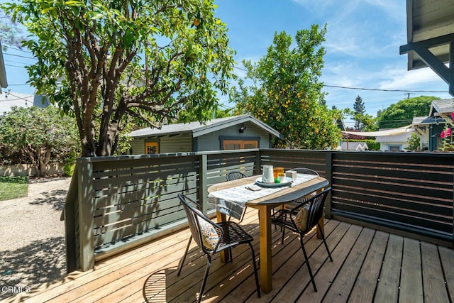 1828 Woodrow Ave, Los Angeles, CA 90041 - wooden deck with outdoor dining space and an outbuilding