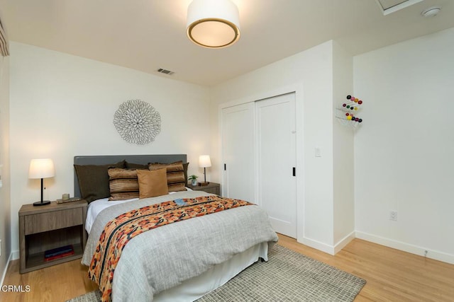 1828 Woodrow Ave, Los Angeles, CA 90041 - bedroom featuring light wood-style flooring, baseboards, and a closet