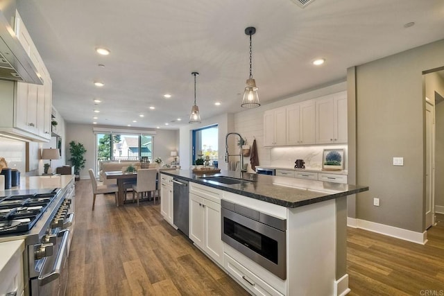 800 Grand Ave Unit 205, Carlsbad, CA 92008 - kitchen featuring a sink, appliances with stainless steel finishes, white cabinetry, dark wood-type flooring, and recessed lighting