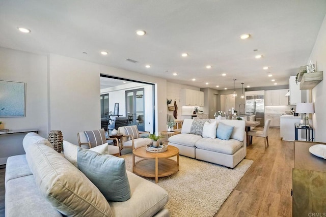 800 Grand Ave Unit 205, Carlsbad, CA 92008 - living room with light wood-type flooring and recessed lighting
