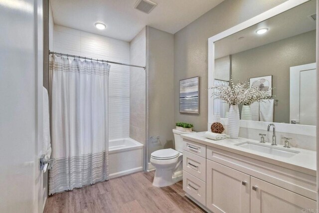 800 Grand Ave Unit 205, Carlsbad, CA 92008 - full bath with shower / bath combo with shower curtain, vanity, and wood finished floors