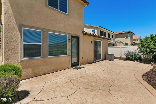 953 Coronado Cir, Santa Paula, CA 93060 - back of property with stucco siding, a patio area, and cooling unit