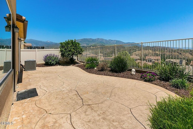 953 Coronado Cir, Santa Paula, CA 93060 - fenced backyard with a mountain view, a patio, and central AC unit