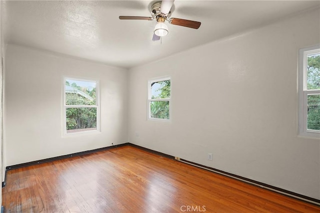 11022 Fruitland Dr, Studio City, CA 91604 - unfurnished room with wood finished floors, a ceiling fan, and baseboards