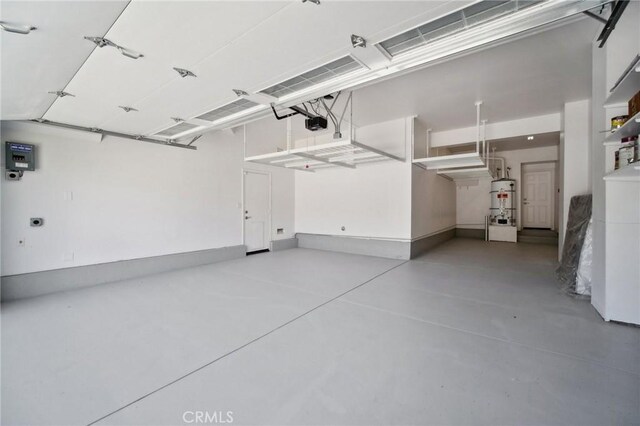 25422 Magnolia Ln, Stevenson Ranch, CA 91381 - garage with a garage door opener and strapped water heater