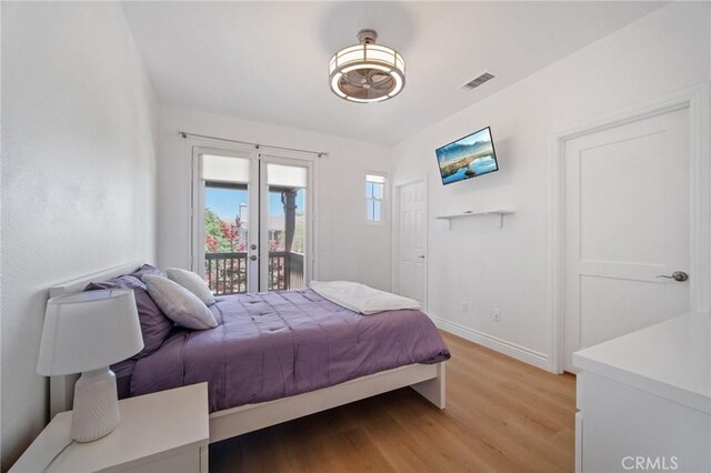 25422 Magnolia Ln, Stevenson Ranch, CA 91381 - bedroom featuring access to outside, light wood finished floors, and baseboards
