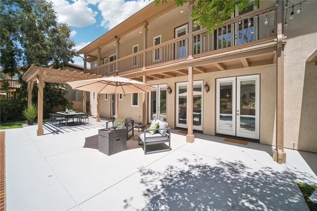 25422 Magnolia Ln, Stevenson Ranch, CA 91381 - view of patio featuring a balcony, french doors, and outdoor dining space