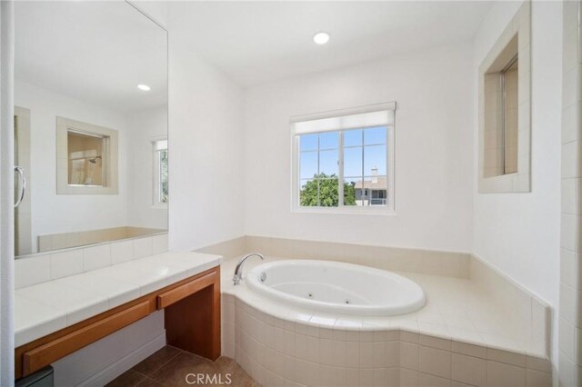 25422 Magnolia Ln, Stevenson Ranch, CA 91381 - bathroom with a tub with jets, vanity, healthy amount of natural light, and recessed lighting