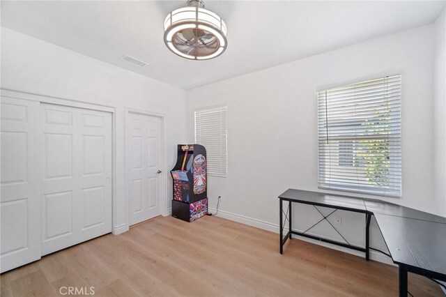 25422 Magnolia Ln, Stevenson Ranch, CA 91381 - unfurnished bedroom featuring light wood-type flooring, baseboards, and a chandelier