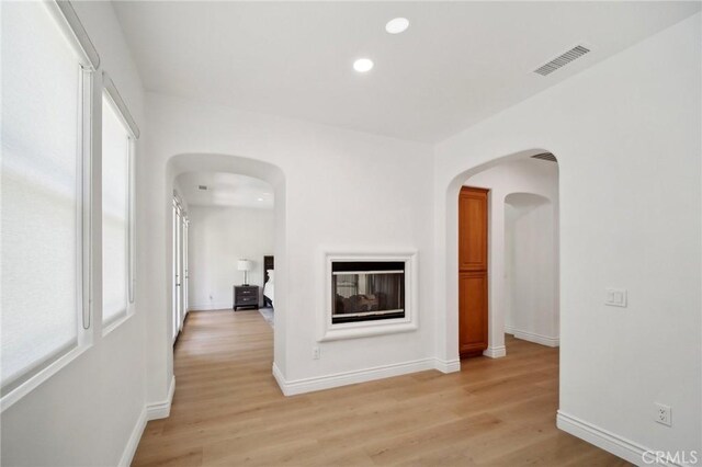 25422 Magnolia Ln, Stevenson Ranch, CA 91381 - hallway with recessed lighting, light wood finished floors, baseboards, and arched walkways