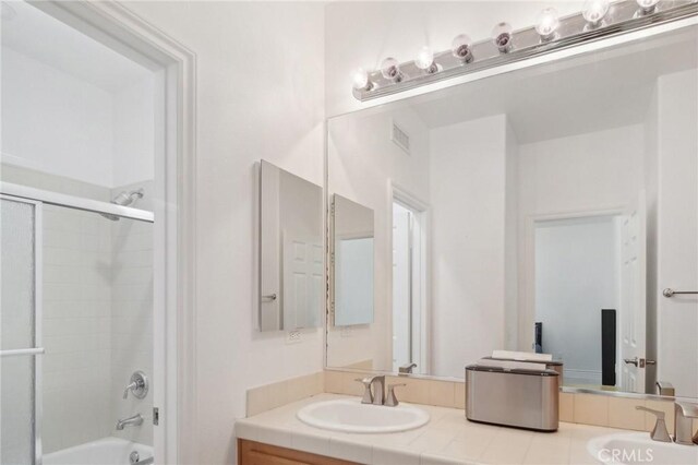 25422 Magnolia Ln, Stevenson Ranch, CA 91381 - full bathroom with double vanity and bath / shower combo with glass door